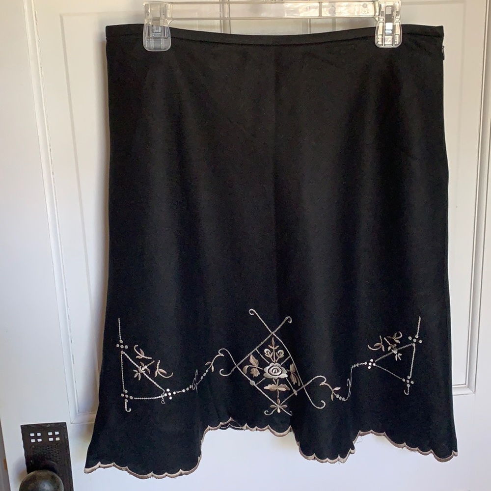 Black A line skirt with floral embroidery at hem